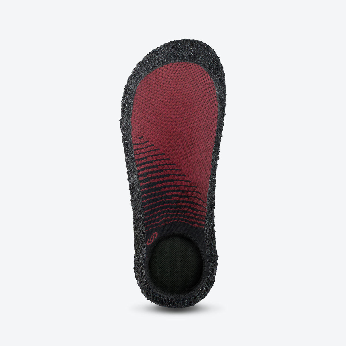 Side view of Skinners sock shoe with a red and black fabric upper and a durable textured sole.