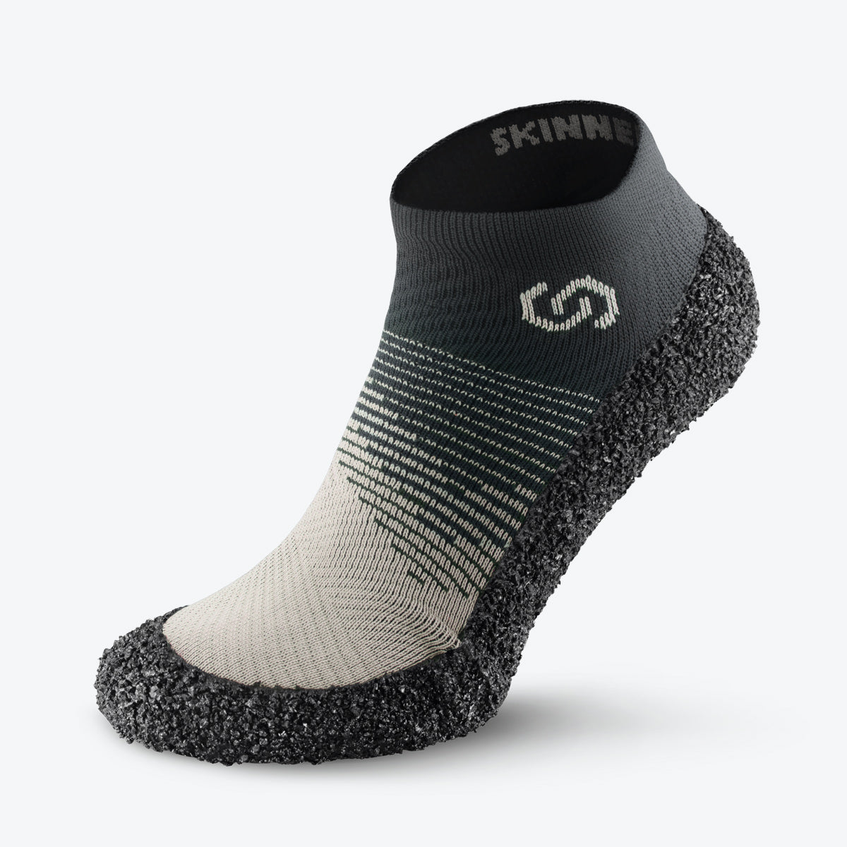 Side view of Skinners sock shoe in ivory, featuring a sleek, minimalist design with a black sole.