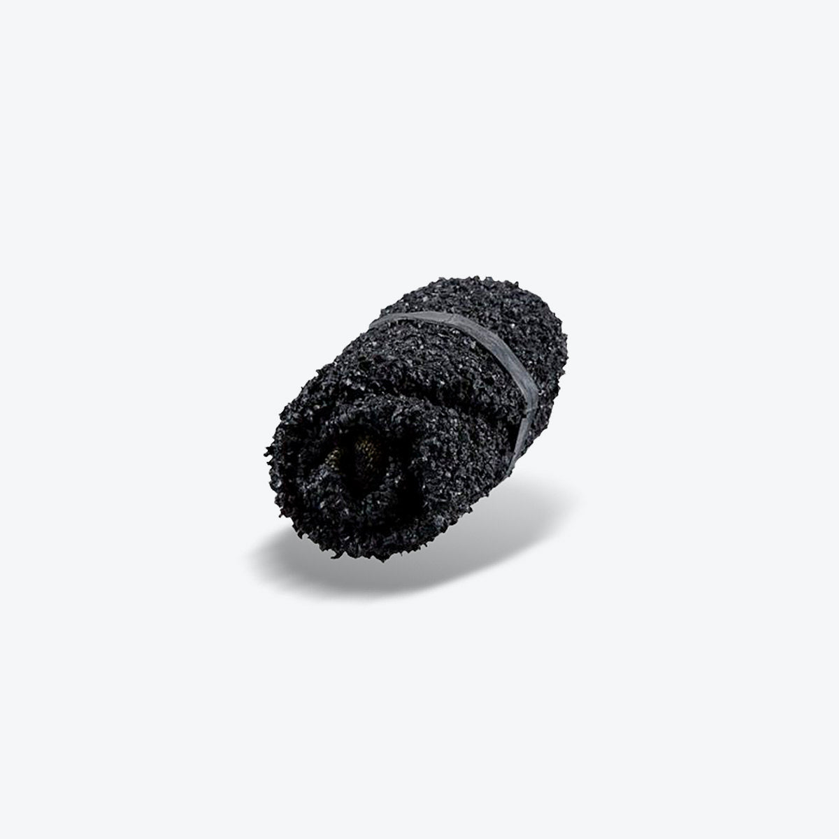 Skinners sock shoe in moss green rolled up to demonstrate its flexibility and compact design.