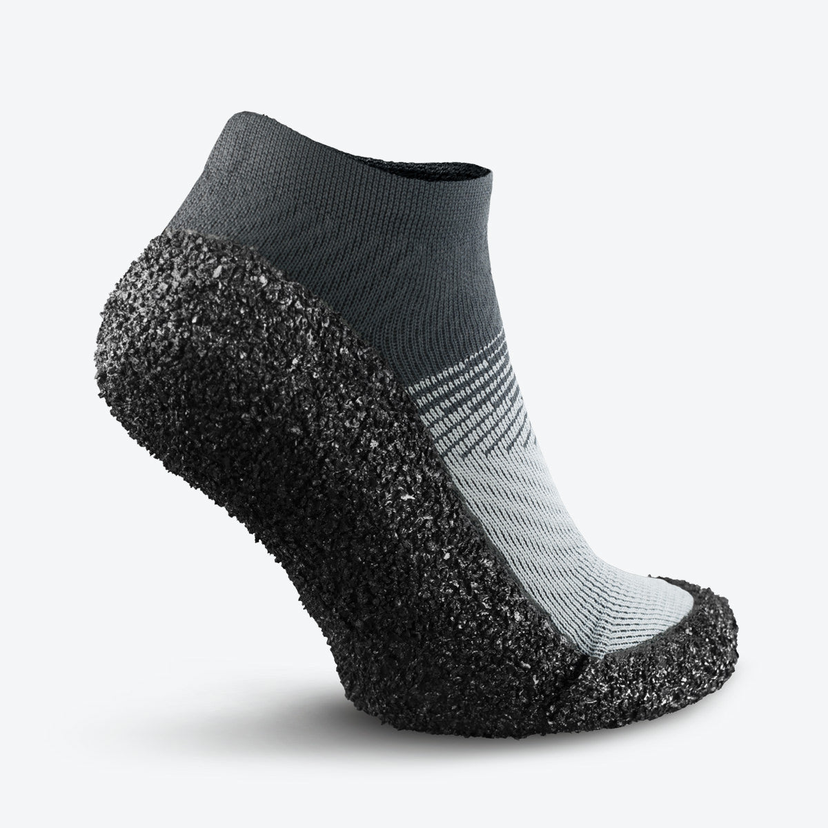 Back angle of stone-colored Skinners sock shoe, highlighting its contoured design for stability.