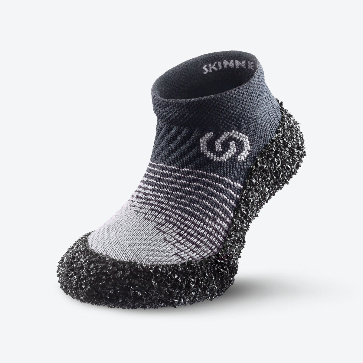 Front view of stone-colored Skinners KIDS-2 sock shoe, designed for durability and comfort in active play.