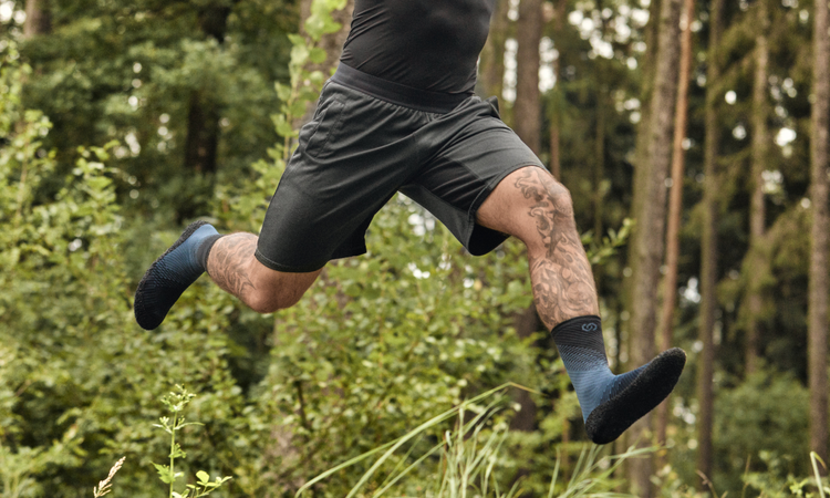 A vibrant lifestyle image of Skinners' micro-crew Compression 2.0 Barefoot Sock Shoe in Aqua, perfect for a mix of casual and active lifestyles, ideal for everyday wear or outdoor activities.