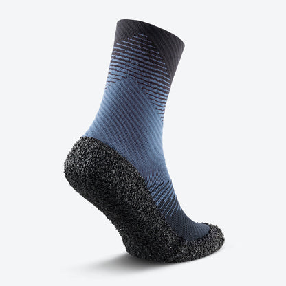 Back view of Pacific blue Skinners compression socks, highlighting their sleek design and ergonomic support.