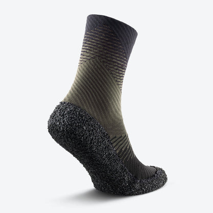 Back view of pine-colored Skinners compression socks, highlighting their contoured fit and reinforced support.